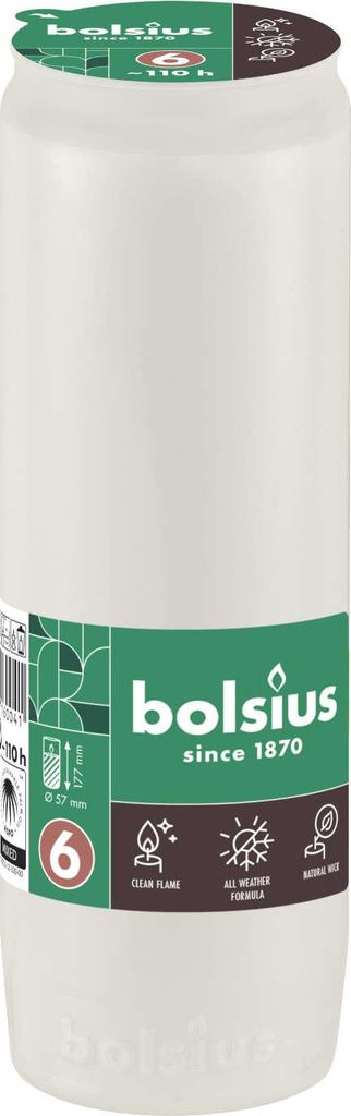 A white candle with a green and brown label.
