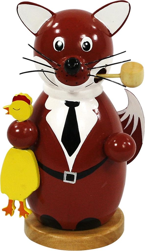 A wooden figurine of a fox dressed in a suit, holding a chick.