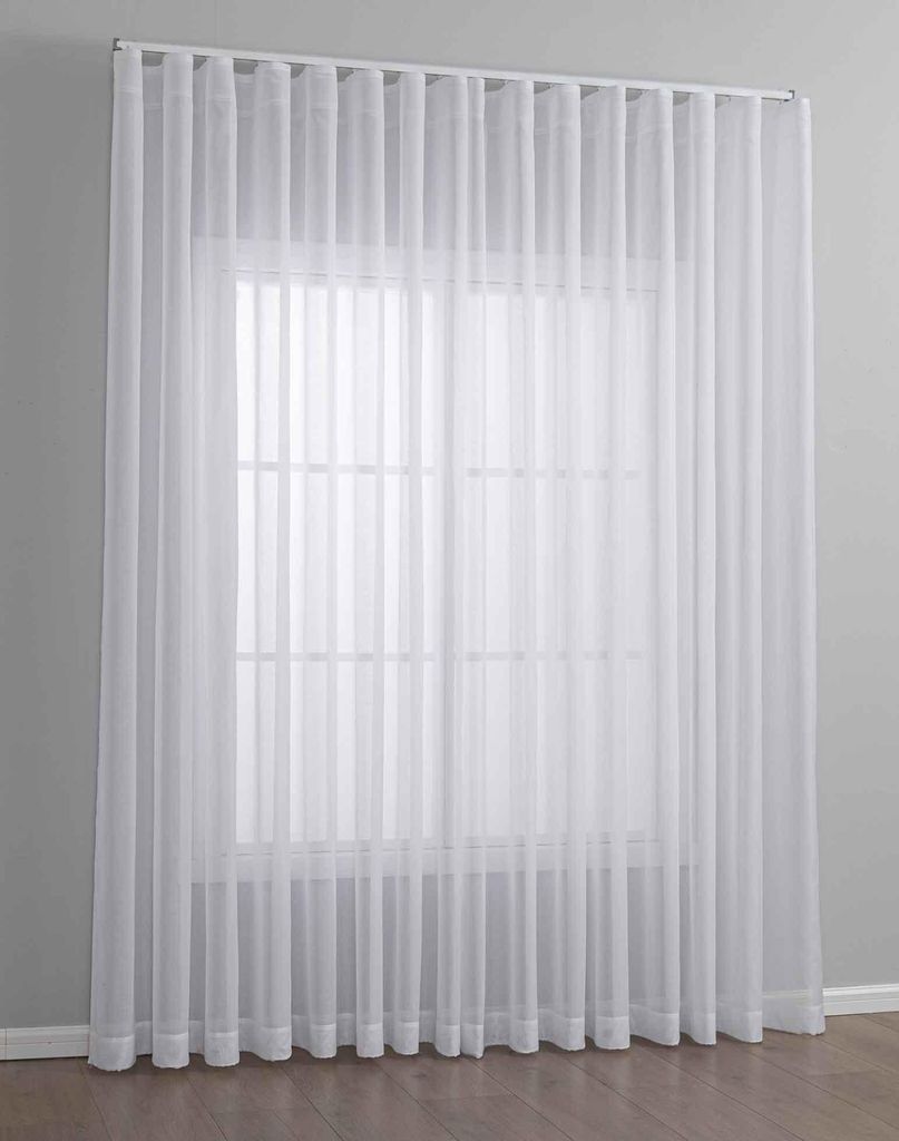 A white sheer curtain hanging in front of a window.
