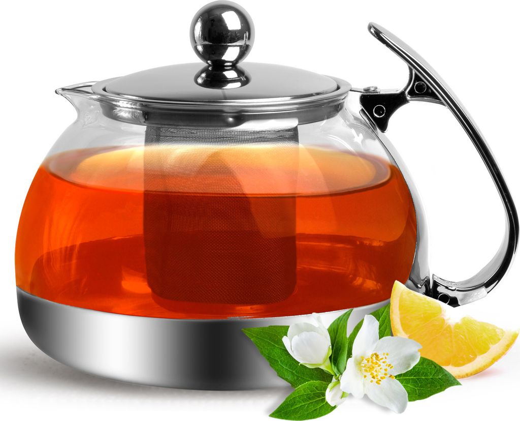 A glass teapot filled with tea, accompanied by jasmine flowers and an orange slice.