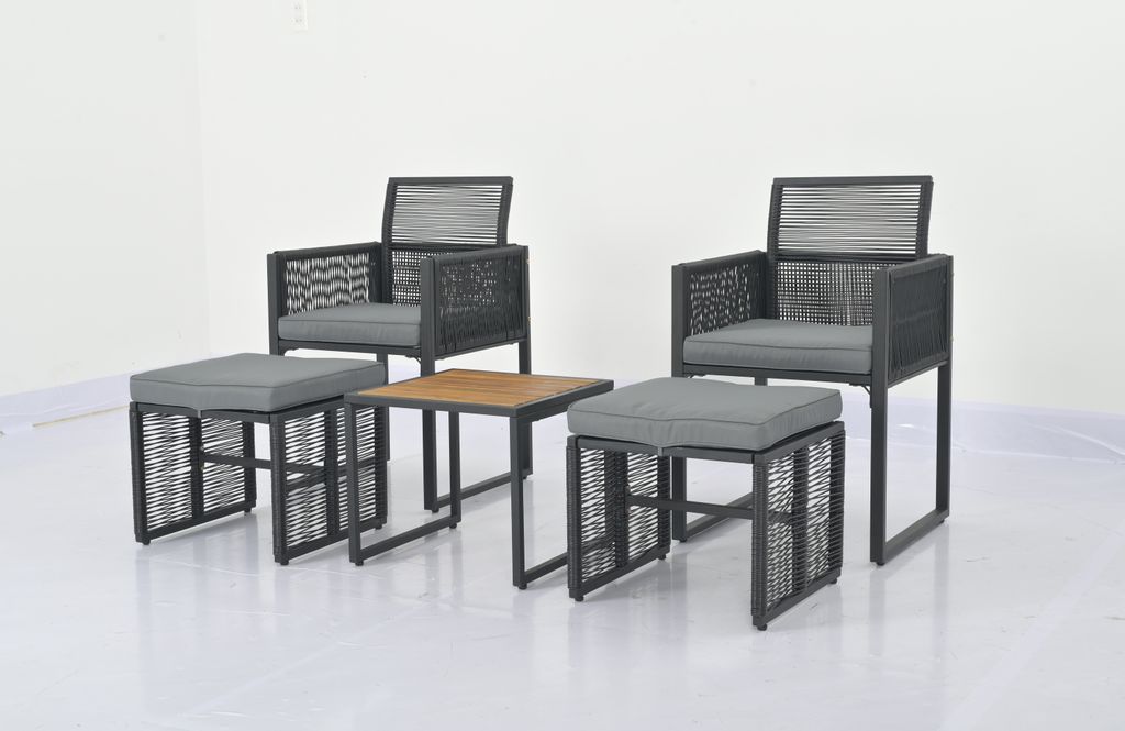 A set of outdoor furniture including two chairs, two ottomans, and a small table, arranged on a white background.