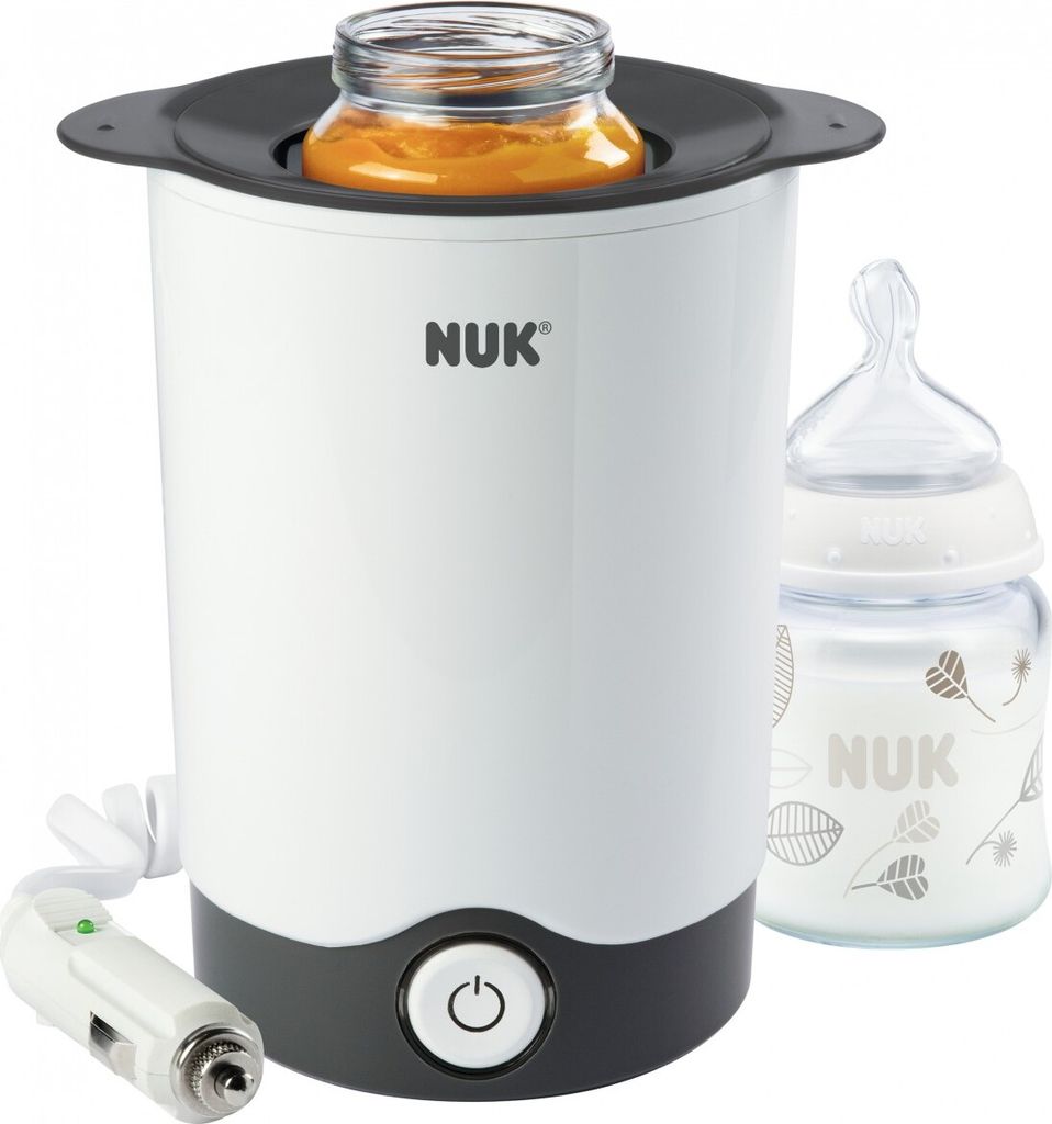 A NUK baby bottle warmer with a jar of baby food and a baby bottle.