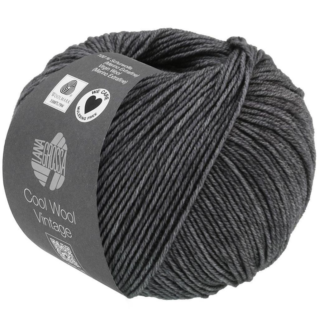 A ball of dark gray yarn with a label wrapped around it.