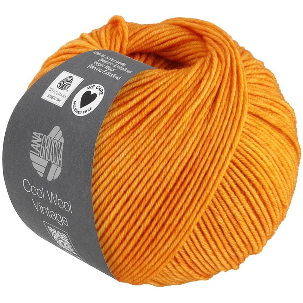 A ball of orange yarn with a label wrapped around it.