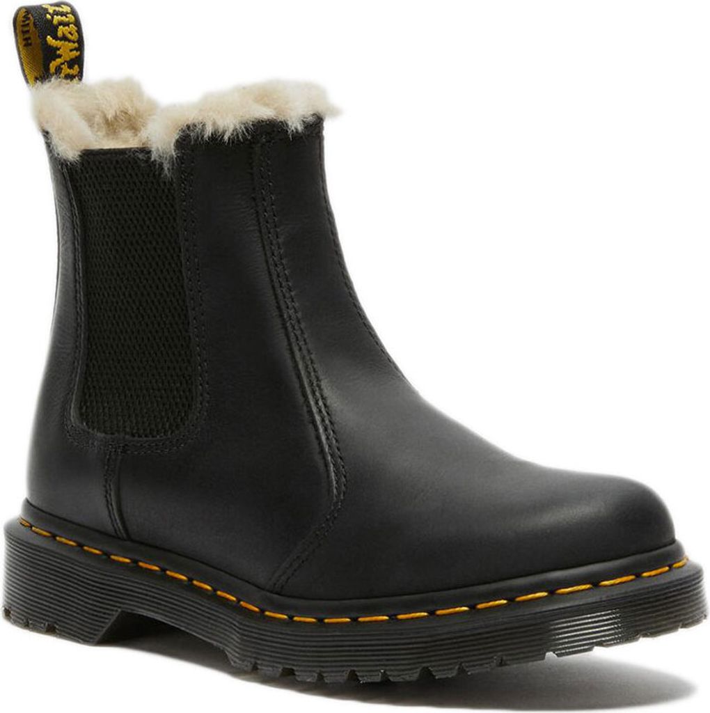 A black Dr. Martens boot with faux fur lining.