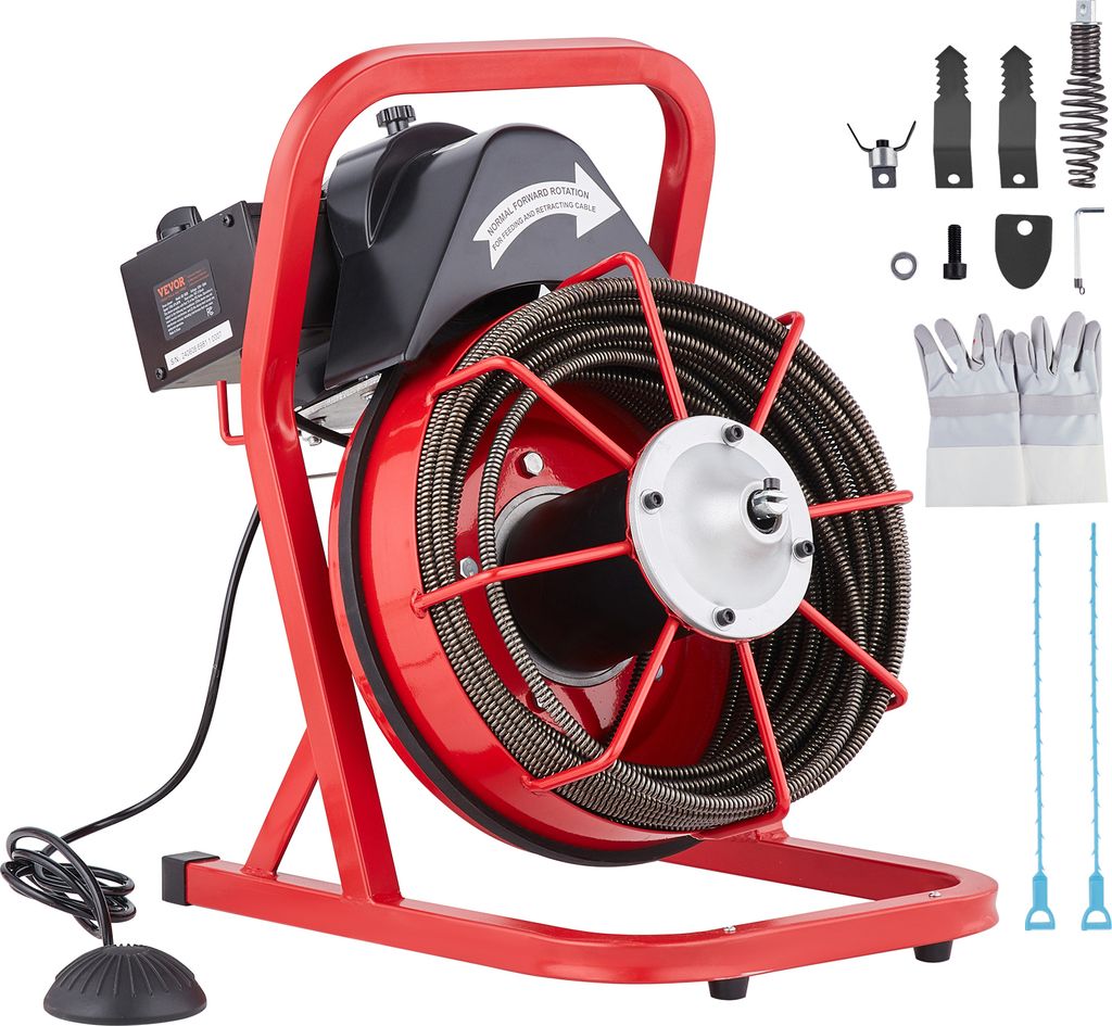 A red and black pipe cleaning machine with a coiled cable and various accessories laid out.
