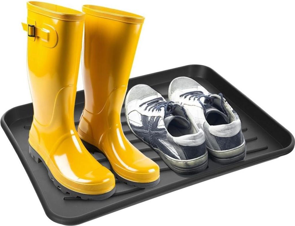 A pair of yellow rubber boots and two athletic shoes are placed on a black shoe tray.
