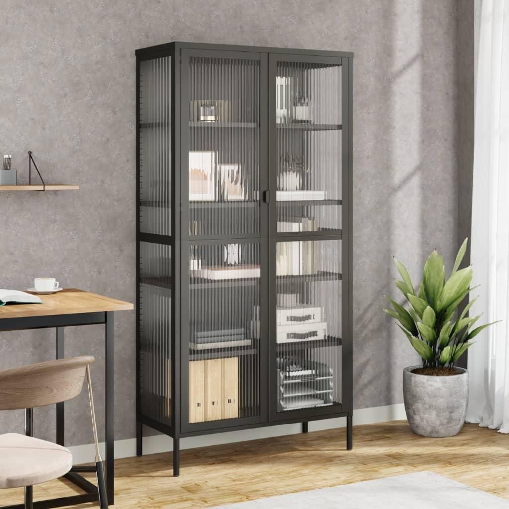 A modern office or living space with a black glass and steel highboard, a desk, and a plant.