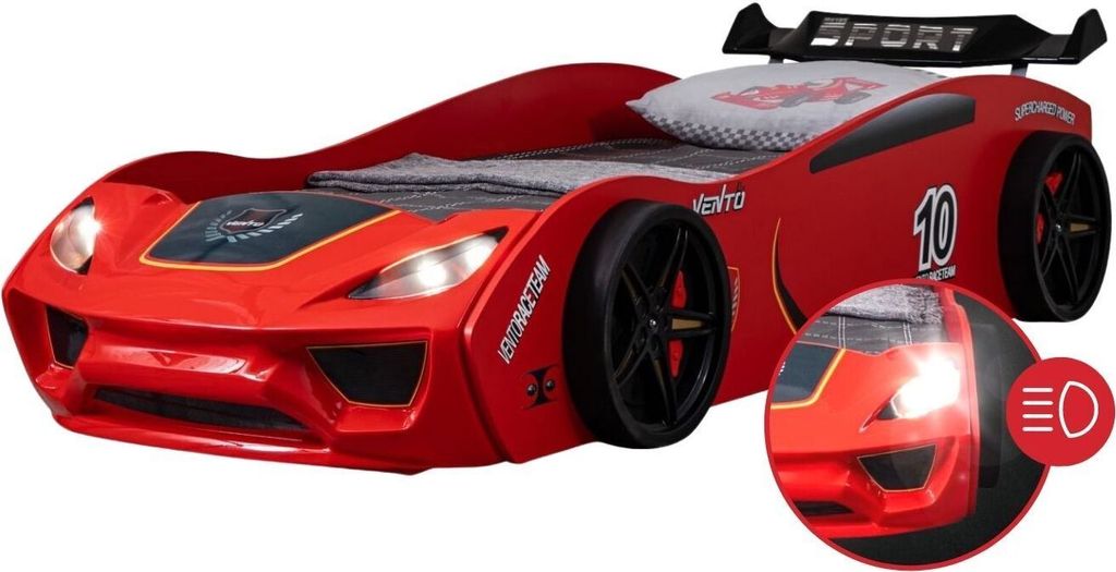 A red race car-shaped children's bed with a spoiler and wheels.