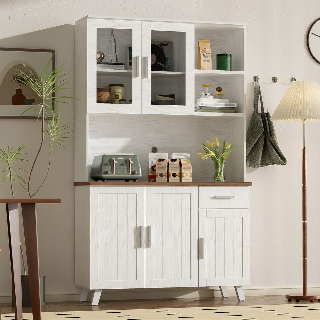 A white hutch cabinet with glass doors and wooden accents in a room.