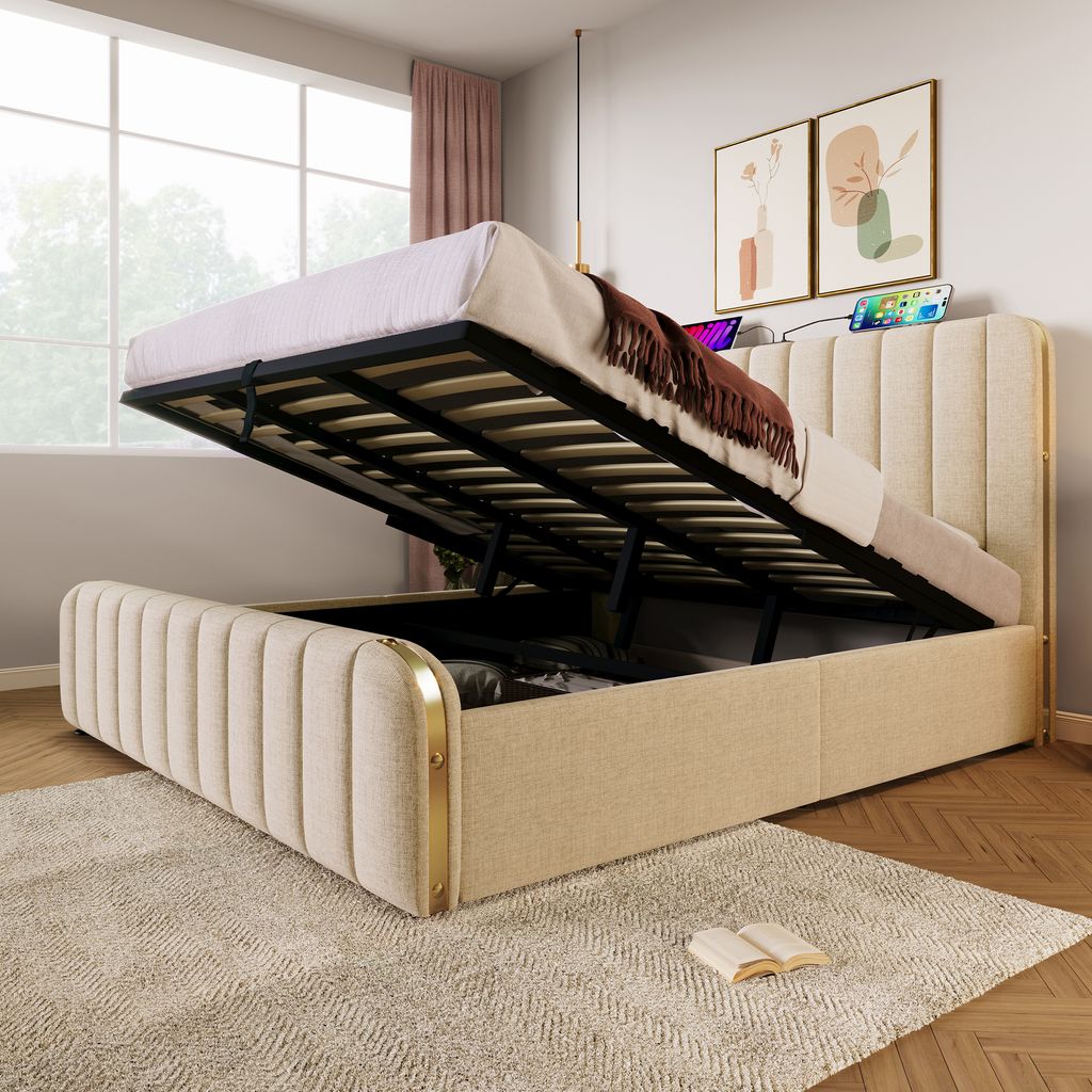 A bed with its storage compartment open, showing the mattress and bedding, in a bedroom setting.