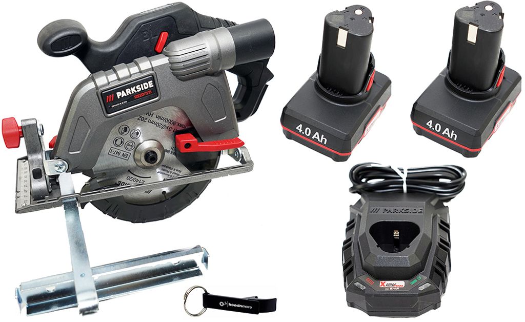 A cordless circular saw kit with batteries and a charger, laid out on a white background.