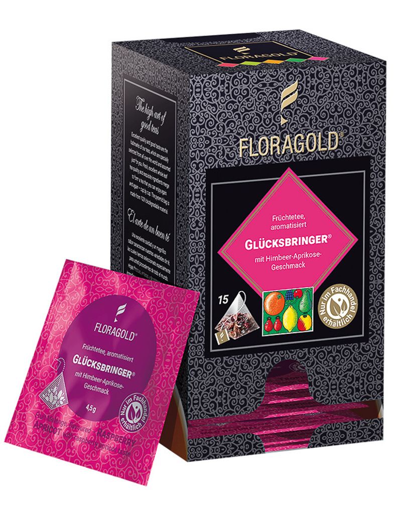 A box of Floragold tea with one tea bag in front of it.