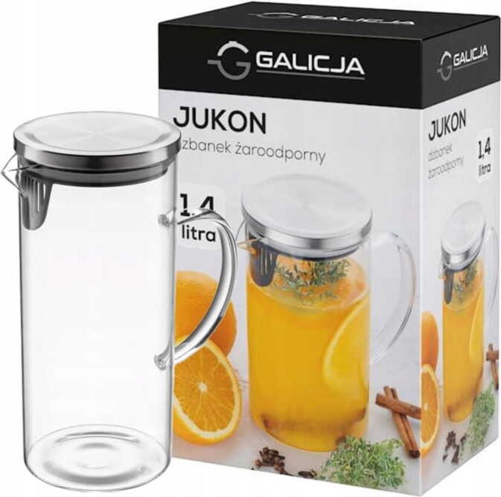 A product shot of a glass jug and its packaging, with oranges and spices as decoration.