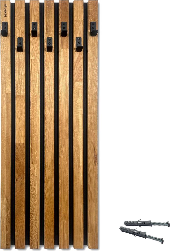 A wooden coat rack with black hooks mounted on a black background, with two wall plugs in the lower right corner.