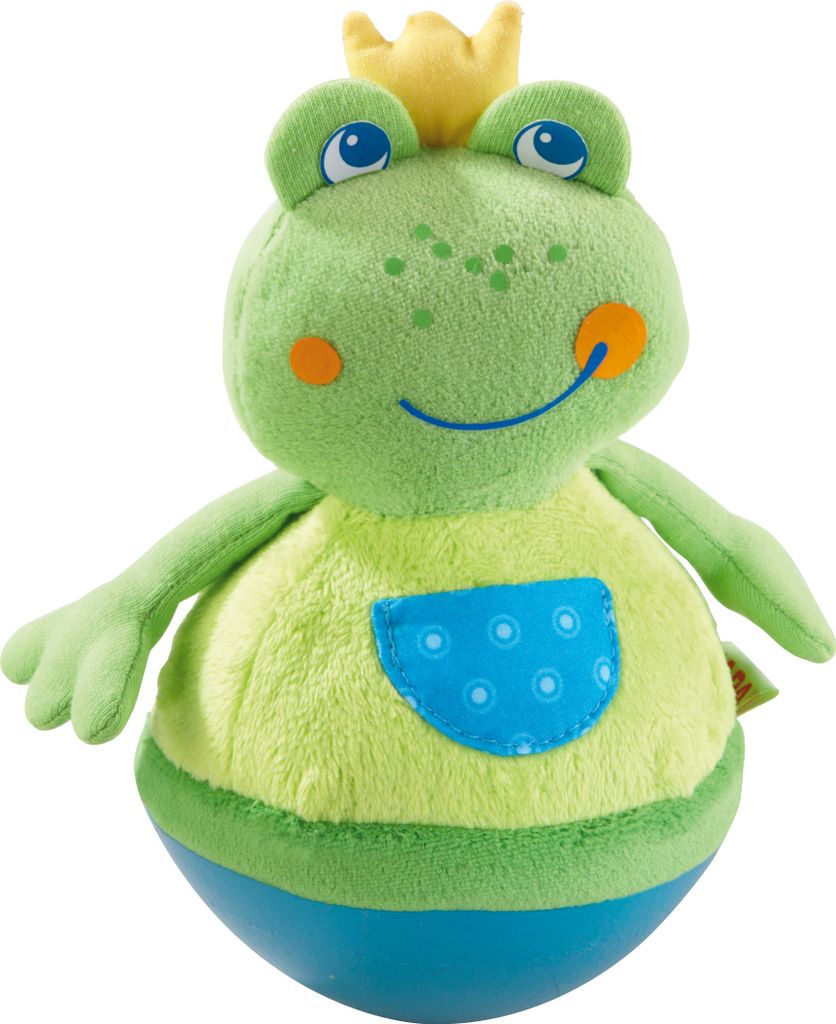 A plush toy frog wearing a crown and a shirt with a pocket.