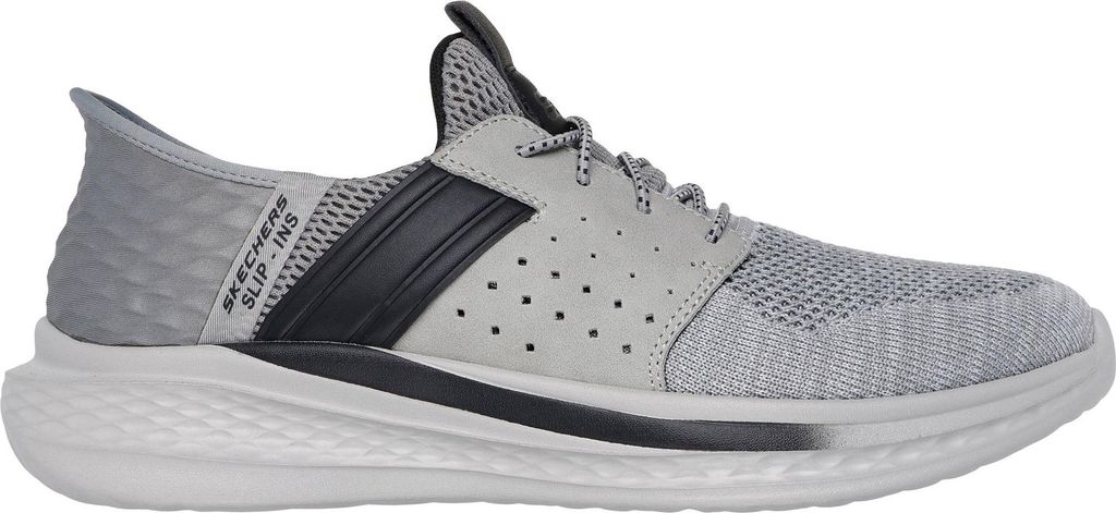 A side view of a grey Skechers shoe.