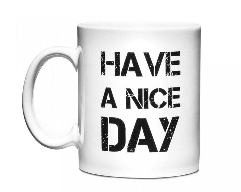 A white ceramic mug with black text printed on it.