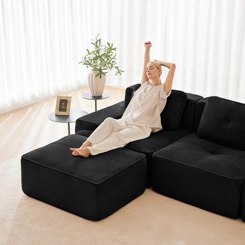 Canapé-lit d'angle modulable noir idéal pour petit salon et relaxation