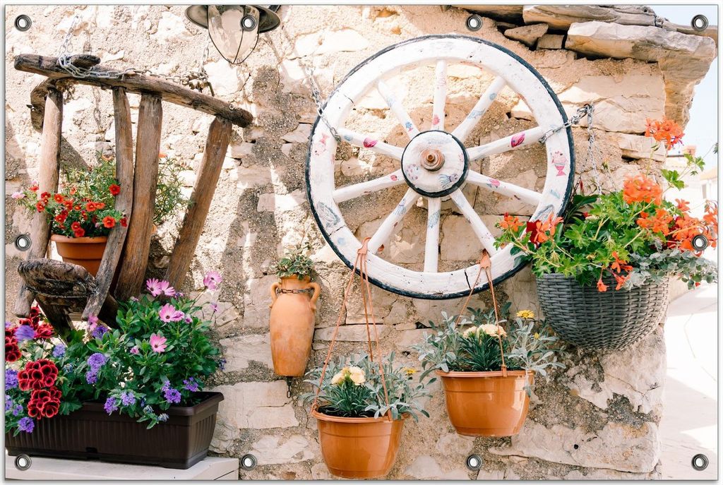 Wallario Outdoor-Poster für Garten oder Balkon, Motiv Wagenrad an Natursteinwand, in ca. 80 x 120 cm