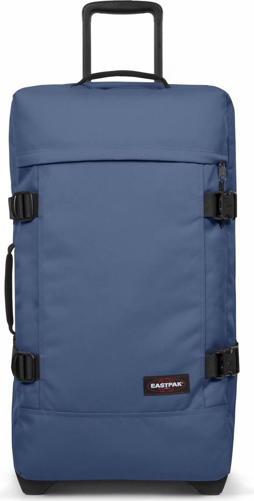 A blue Eastpak suitcase with wheels is shown against a white background.