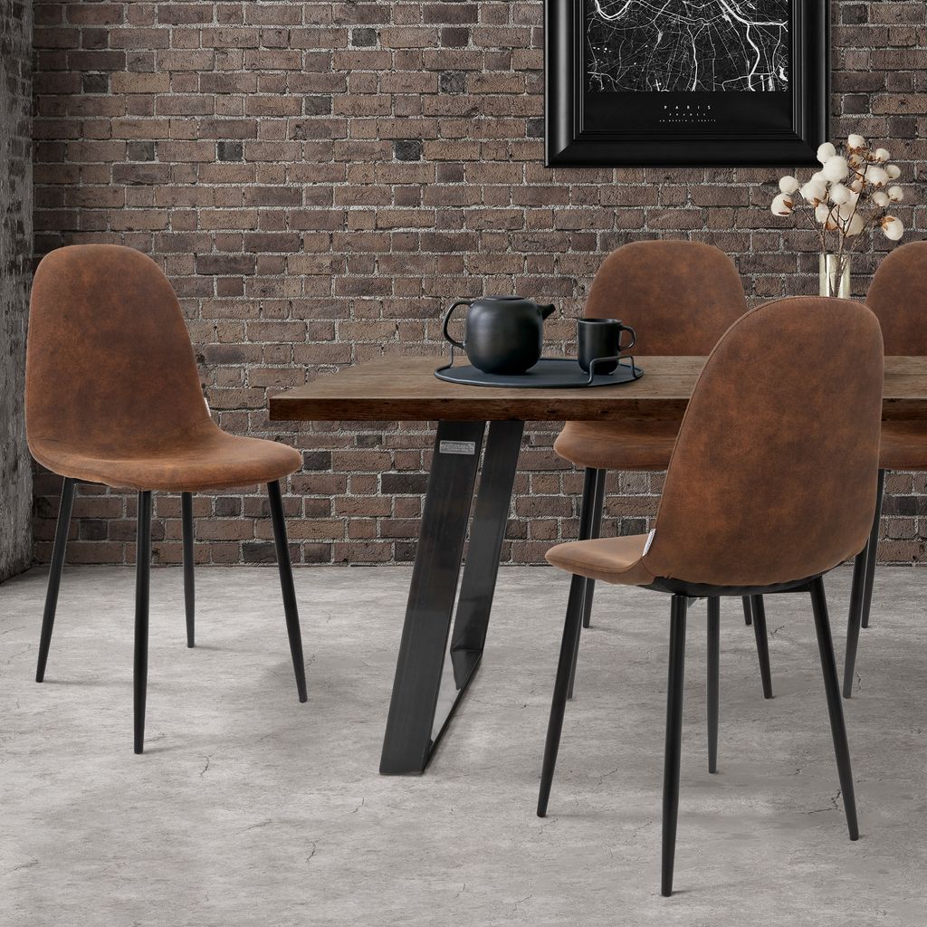 A dining room setting with a table and chairs.