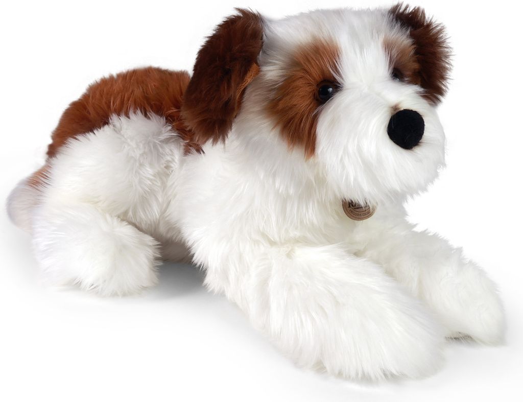 A plush dog toy lying down on a white background.