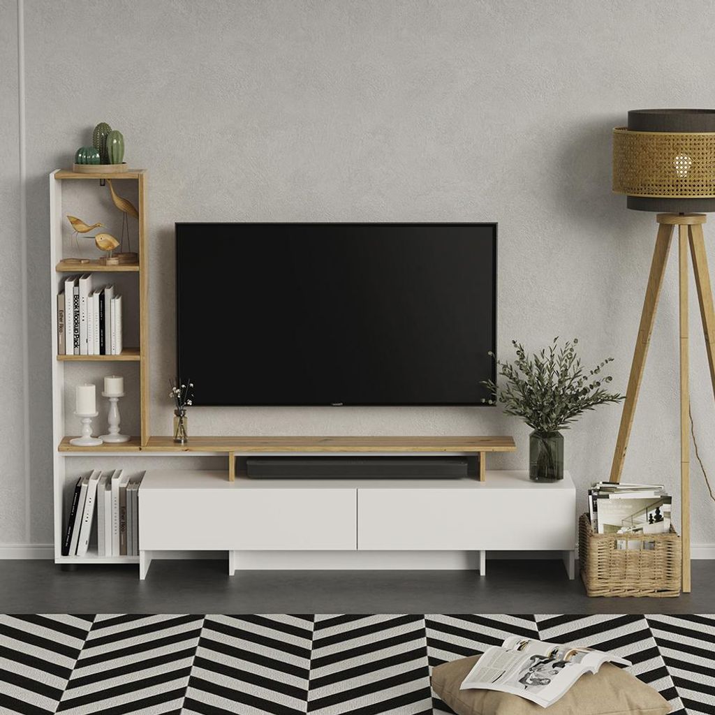 A modern living room setup with a TV stand, TV, bookshelf, and floor lamp.