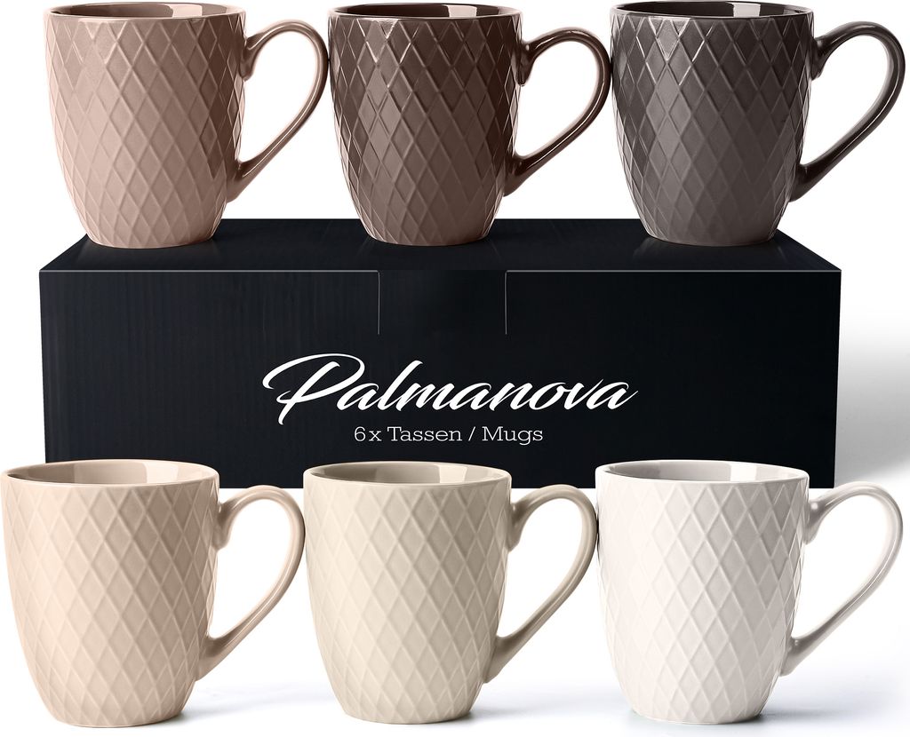 A set of ceramic mugs displayed on a black box with the brand name and product details.