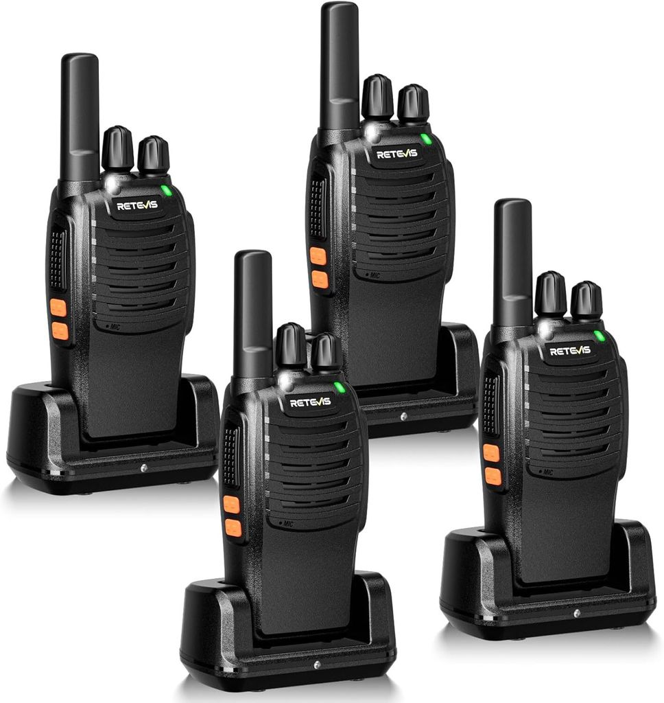 Four black walkie-talkies are arranged in a group, each in its own charging dock.