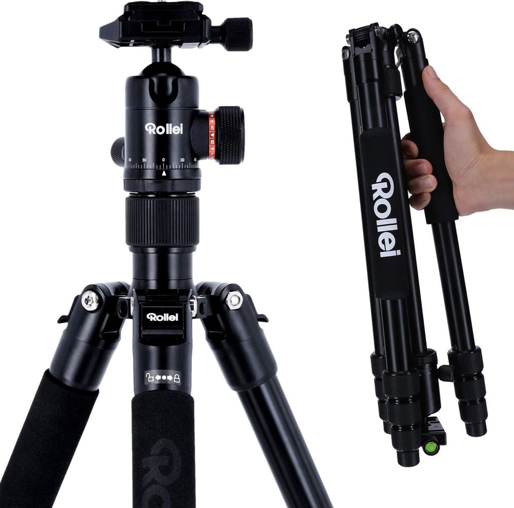 A black Rollei C5i camera tripod is shown, with one leg being held by a person's hand.