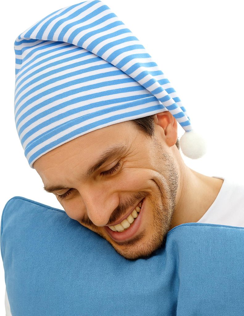 A man wearing a striped sleeping cap is resting his head on a blue pillow.