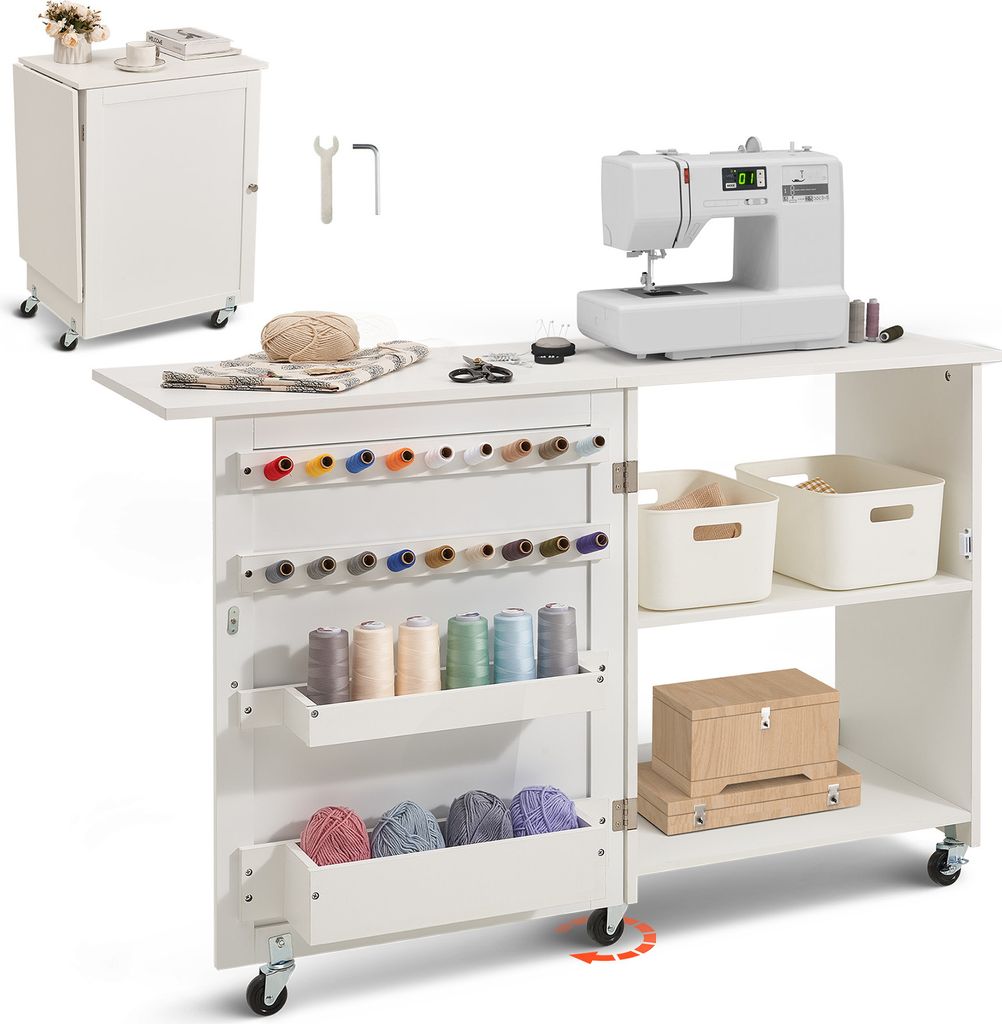 A white sewing table with a sewing machine, spools of thread, and storage bins.