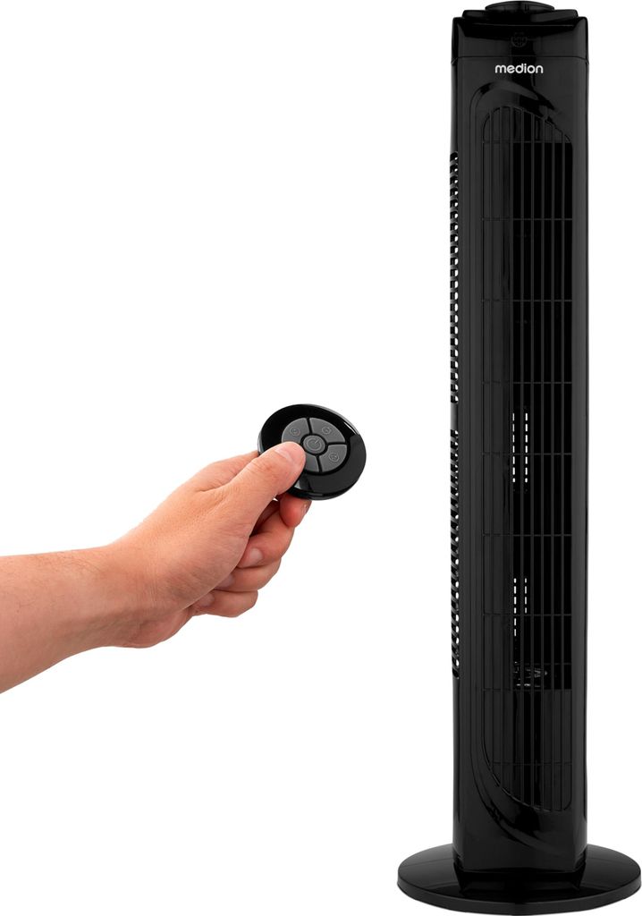 A hand holding a remote control is shown next to a black tower fan.