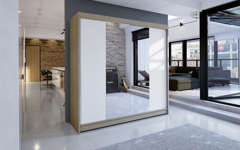 A modern living room with a large wardrobe featuring mirrored doors.