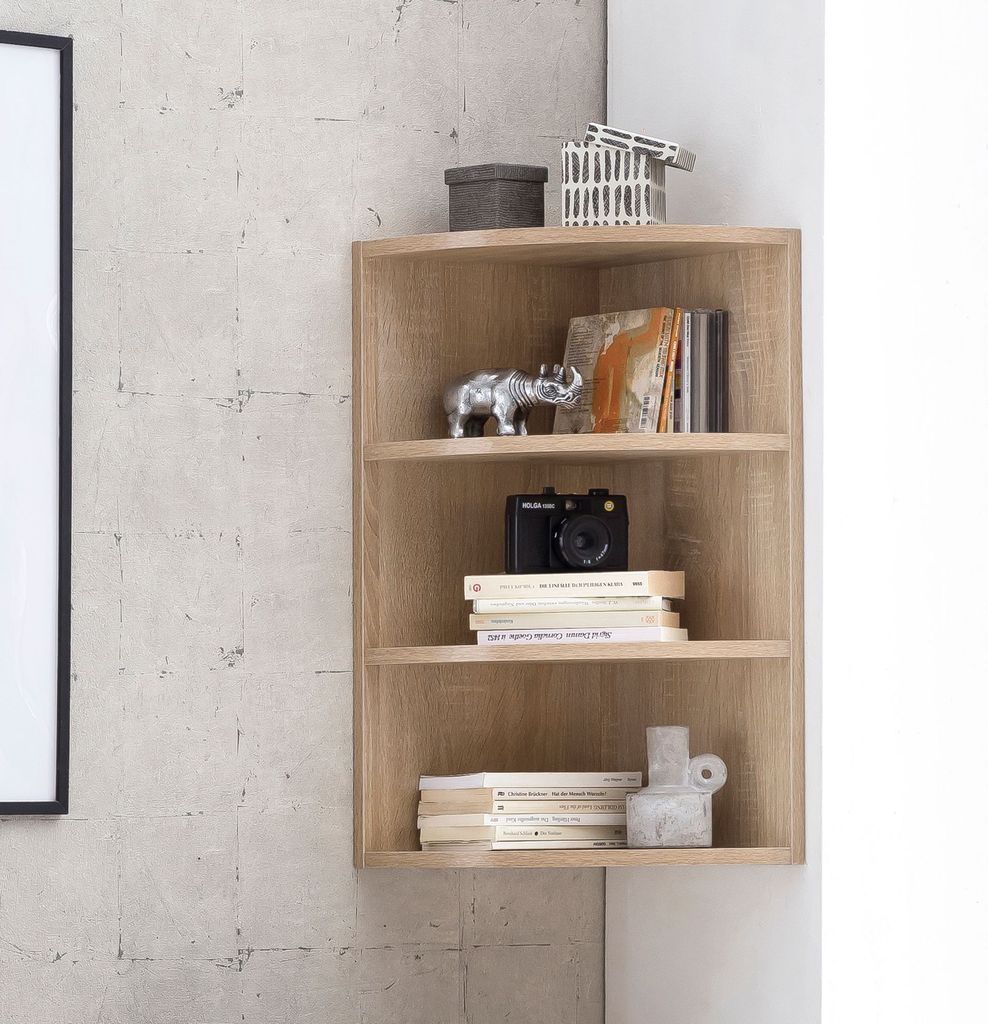 A corner shelf unit with decorative items and books.