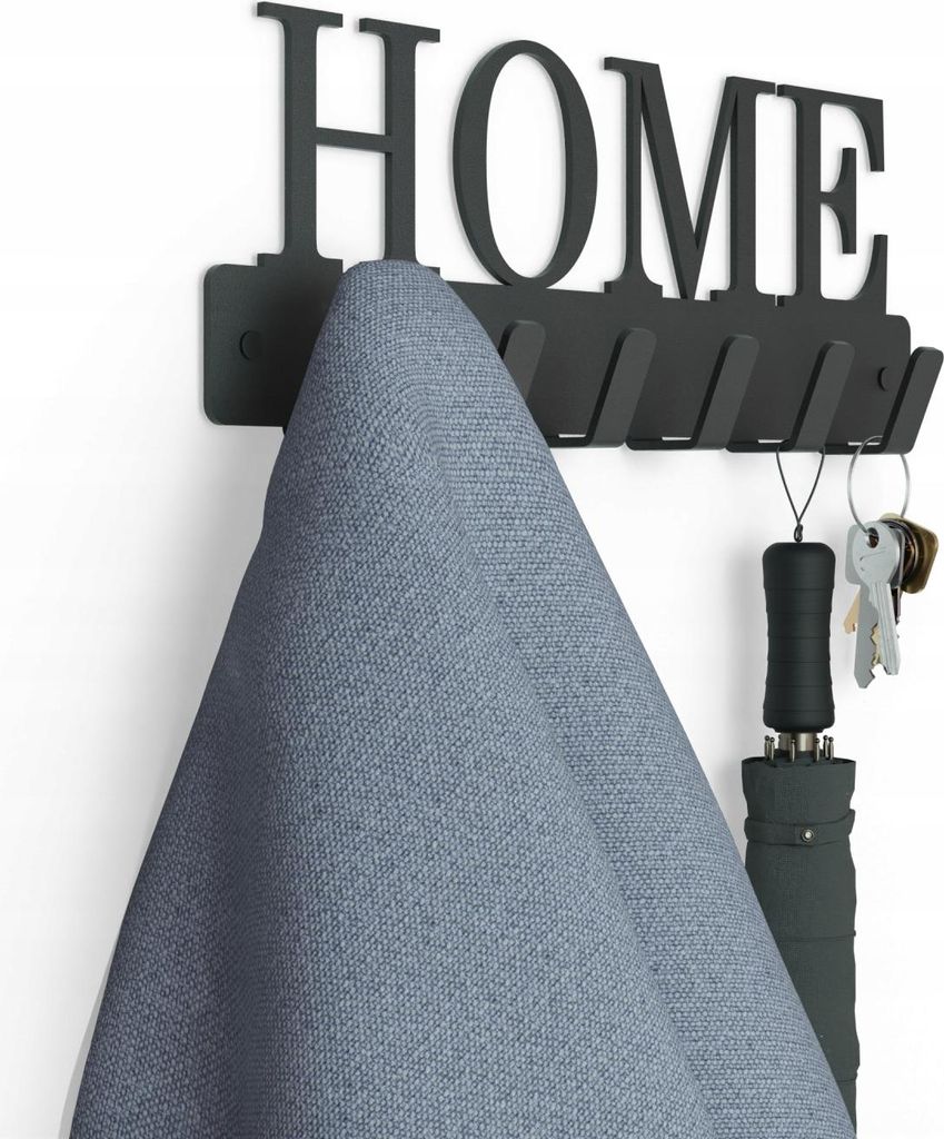 A black metal wall-mounted coat rack with the word 'HOME' cut out, holding a blue fabric item and keys with an umbrella.