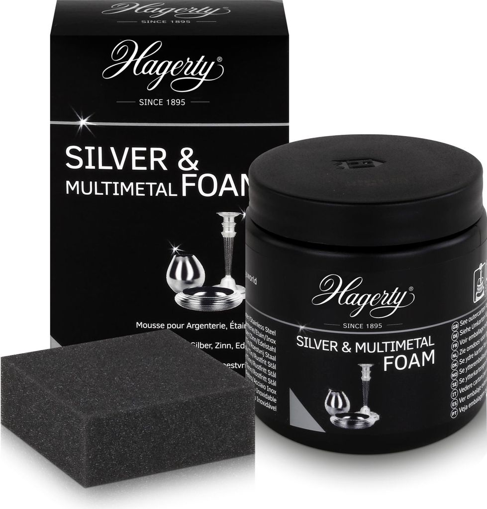 A box, a jar of foam cleaner, and a sponge for cleaning silver and other metals are displayed against a white background.