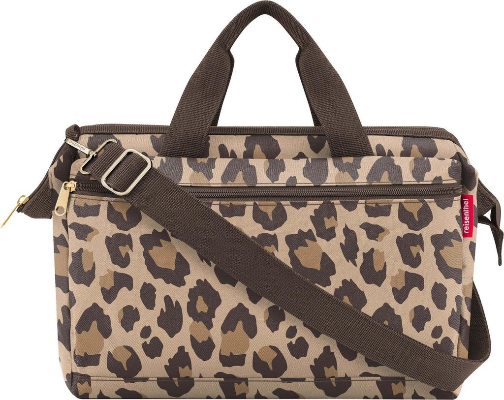 A studio shot of a leopard print bag.