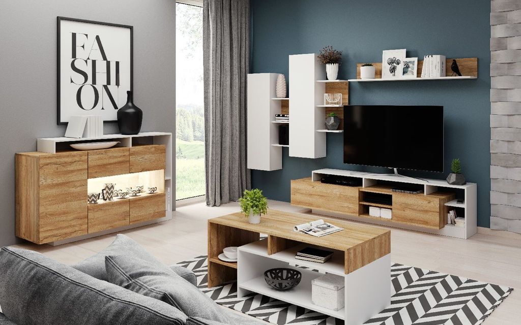 A modern living room set with a TV stand, coffee table, and wall units.