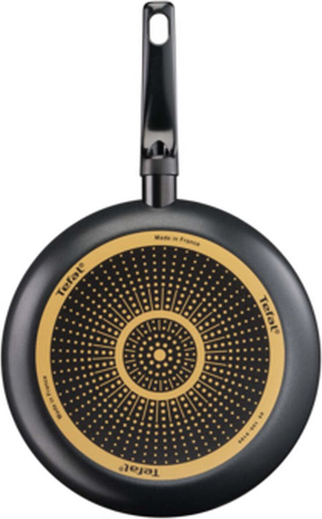 The image shows the underside of a Tefal frying pan against a white background.