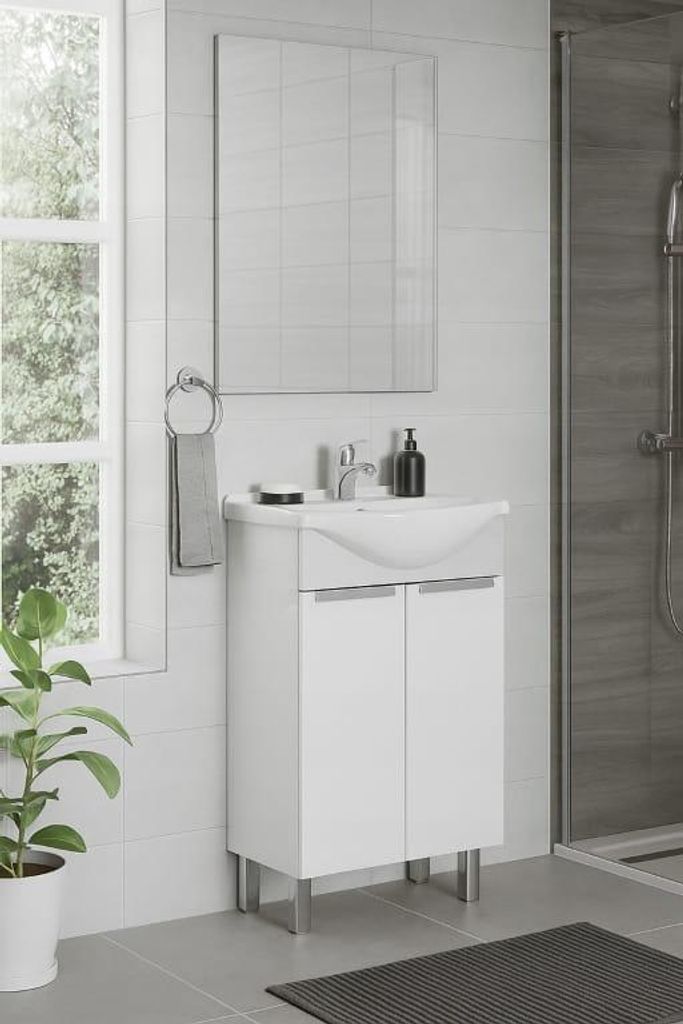 A modern bathroom vanity with a sink and faucet, set against a tiled wall with a window and a shower in the background.