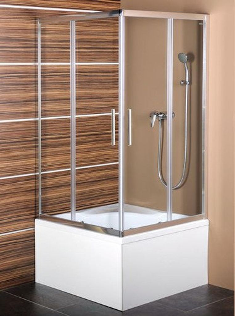 A shower enclosure with a shower head and controls, installed over a bathtub. The background features wood-look tiles and a plain wall.