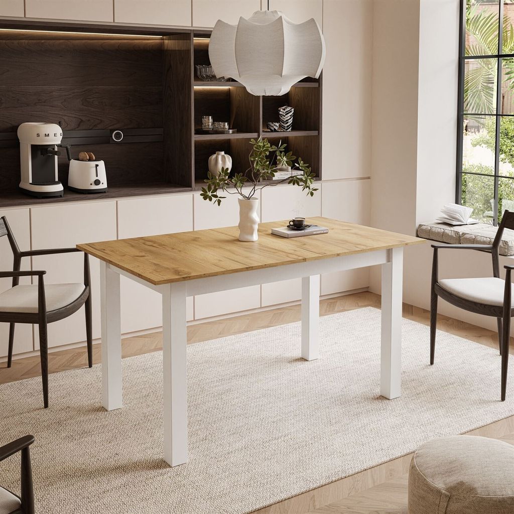 A dining room scene with a table and chairs, set up for a meal.