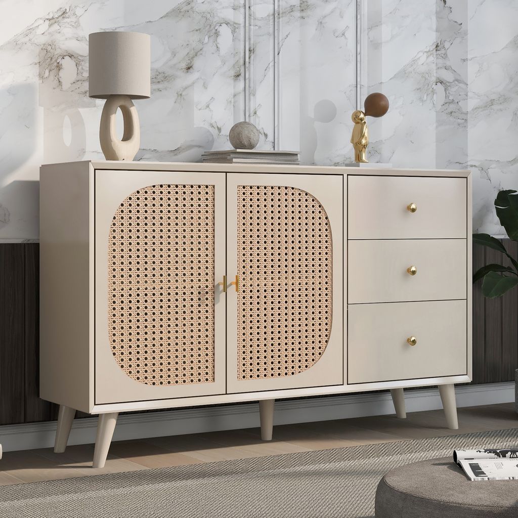 A sideboard with rattan doors and drawers, placed in a room with a marble-patterned wall and a rug.