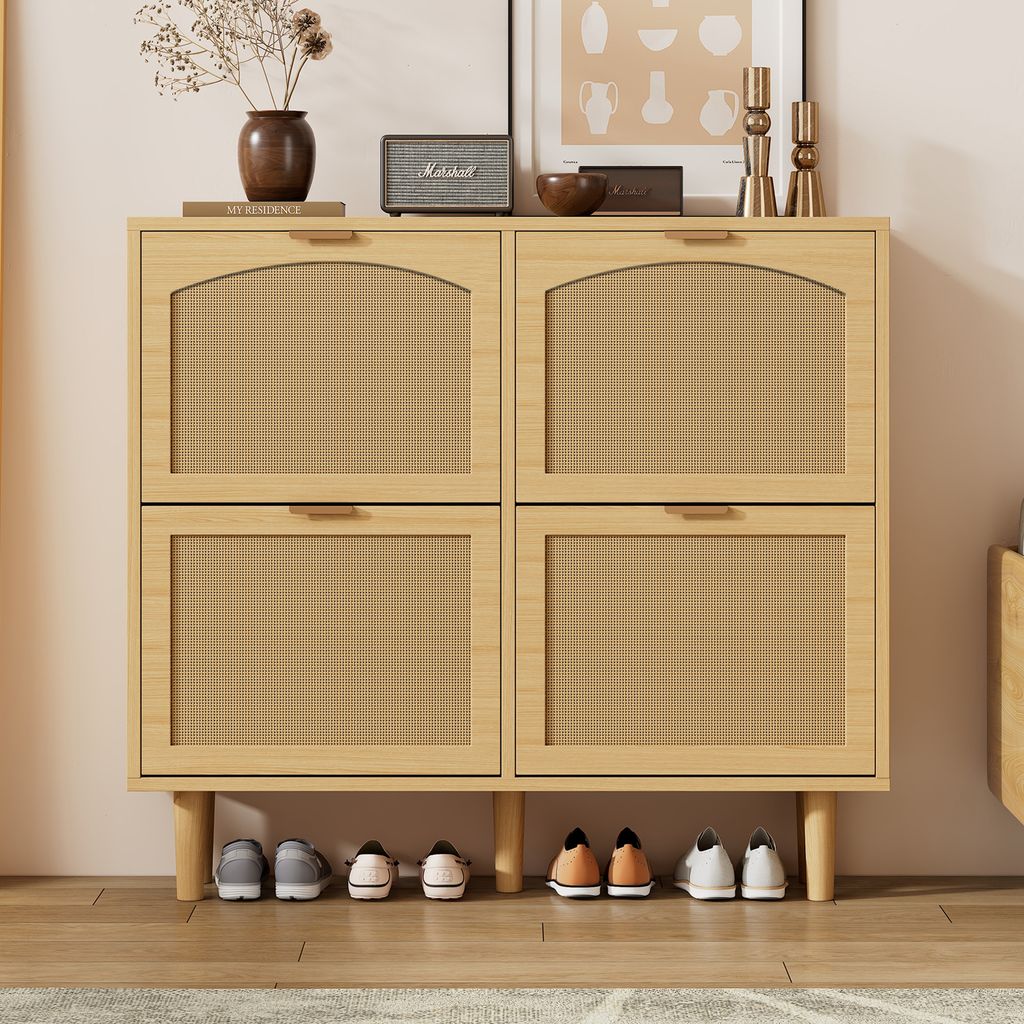 A light wood shoe cabinet with four rattan-fronted doors and a row of shoes underneath.