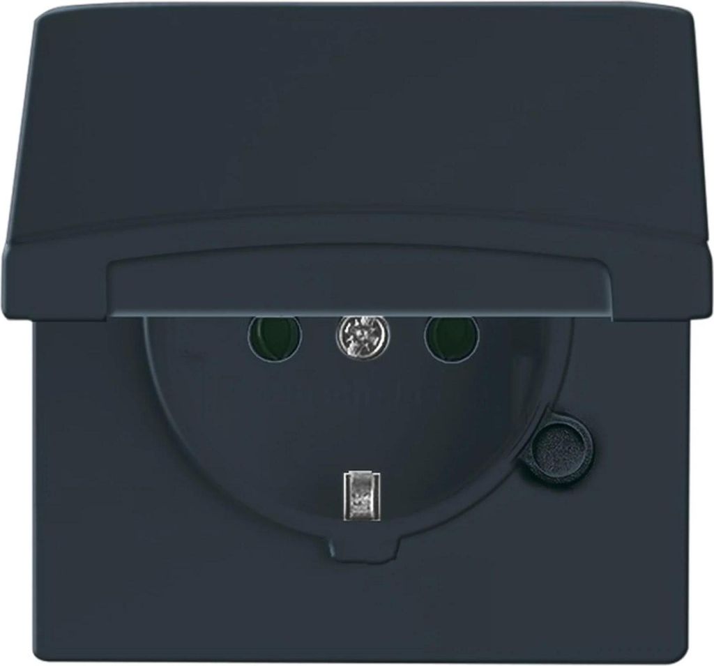 A dark gray electrical outlet with a flip-up cover.