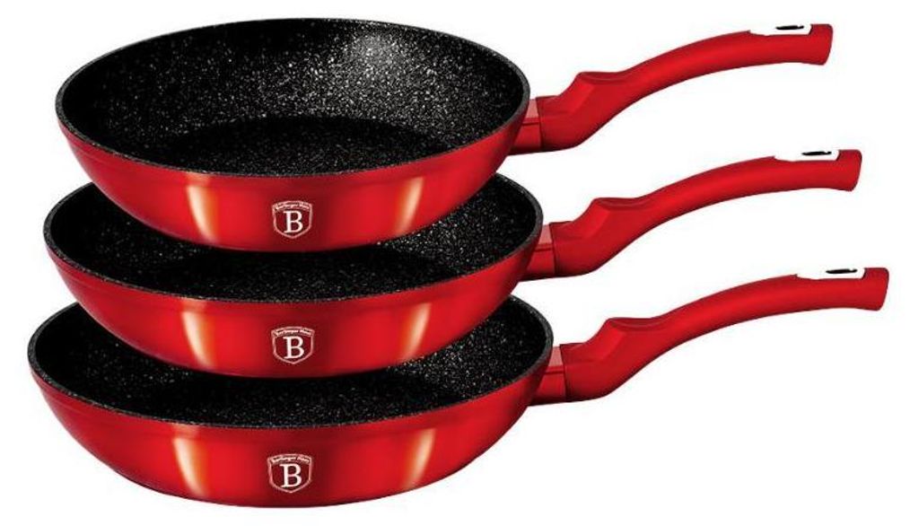 A stack of three red frying pans with black interiors and red handles, displayed against a white background.