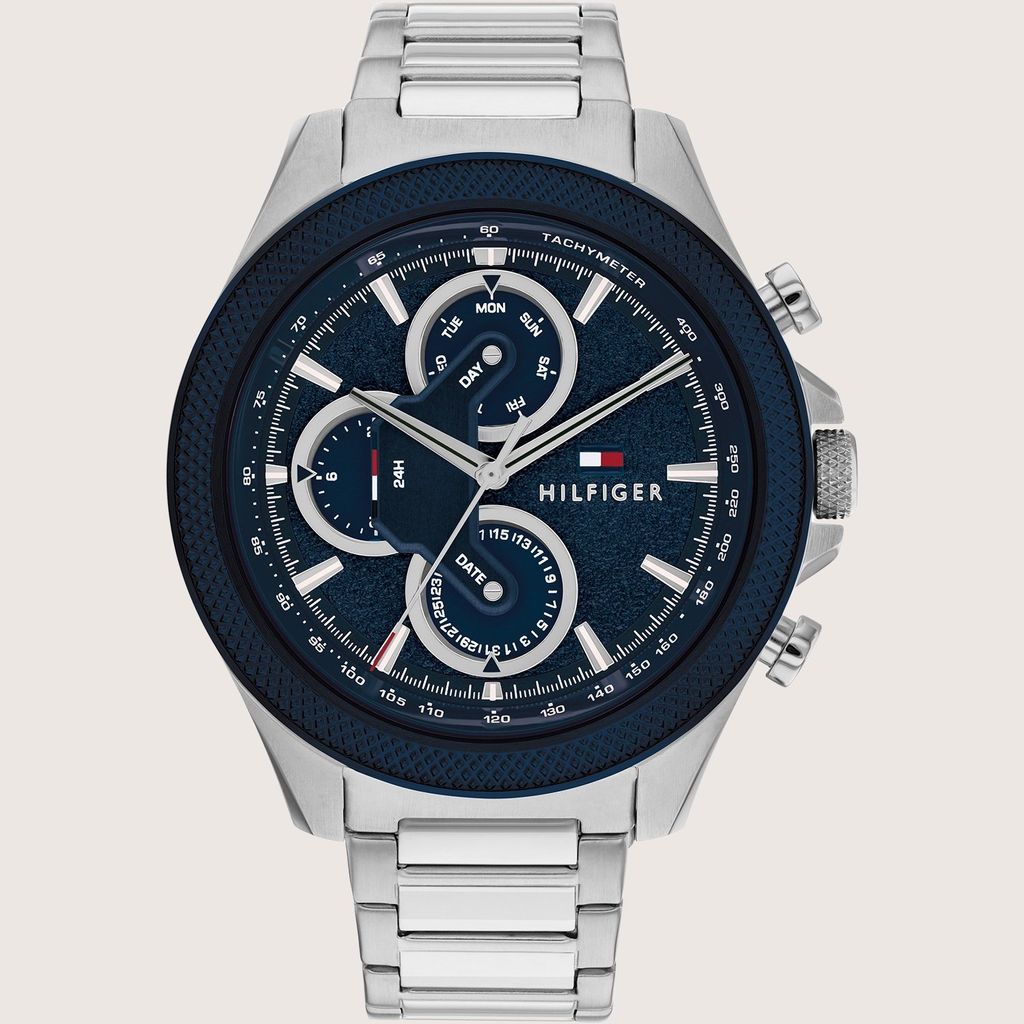 A close-up studio shot of a Tommy Hilfiger analog watch.