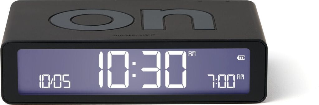 A black digital alarm clock with a digital display showing the time and alarm settings.